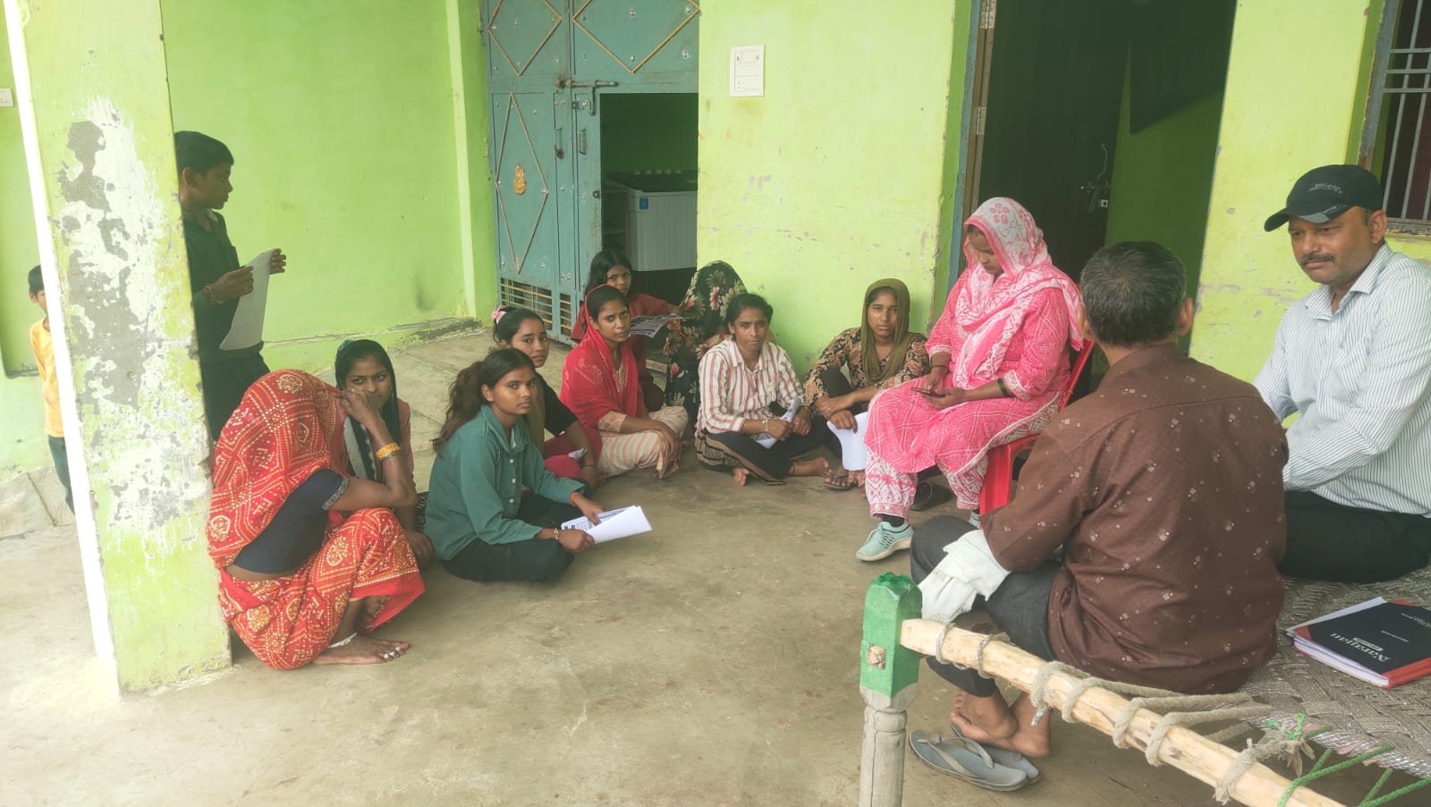 Village mobilisation meeting with young people and their families